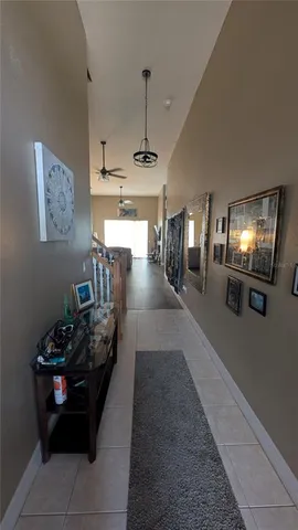 a dining room with furniture and chandelier