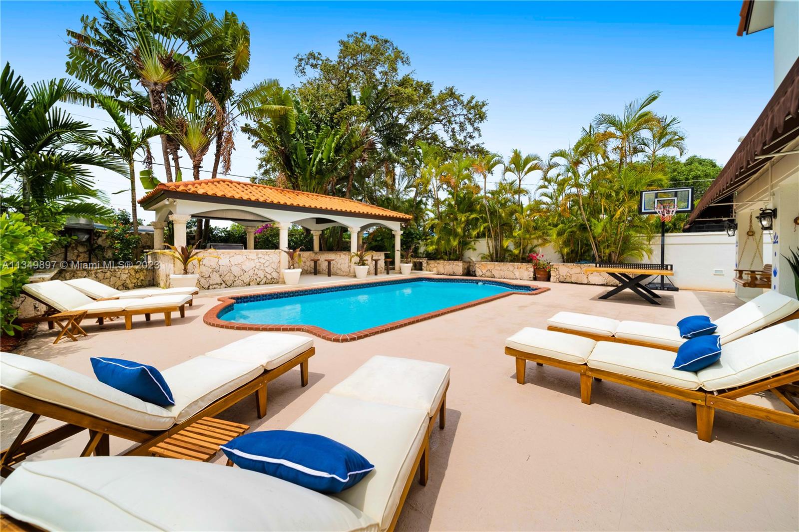 a view of a patio with swimming pool table and chairs