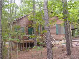 10 Stonewall Road Palmyra, VA 22963 - Photo 1 of 6 a yellow house with trees in front of it