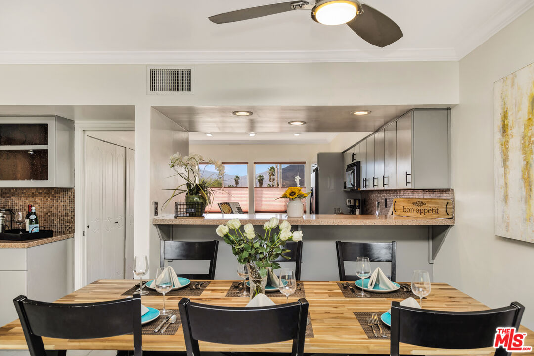 277 East Alejo Road, Unit 119 Palm Springs, CA 92262 - Photo 12 of 46 a living room with fireplace and furniture