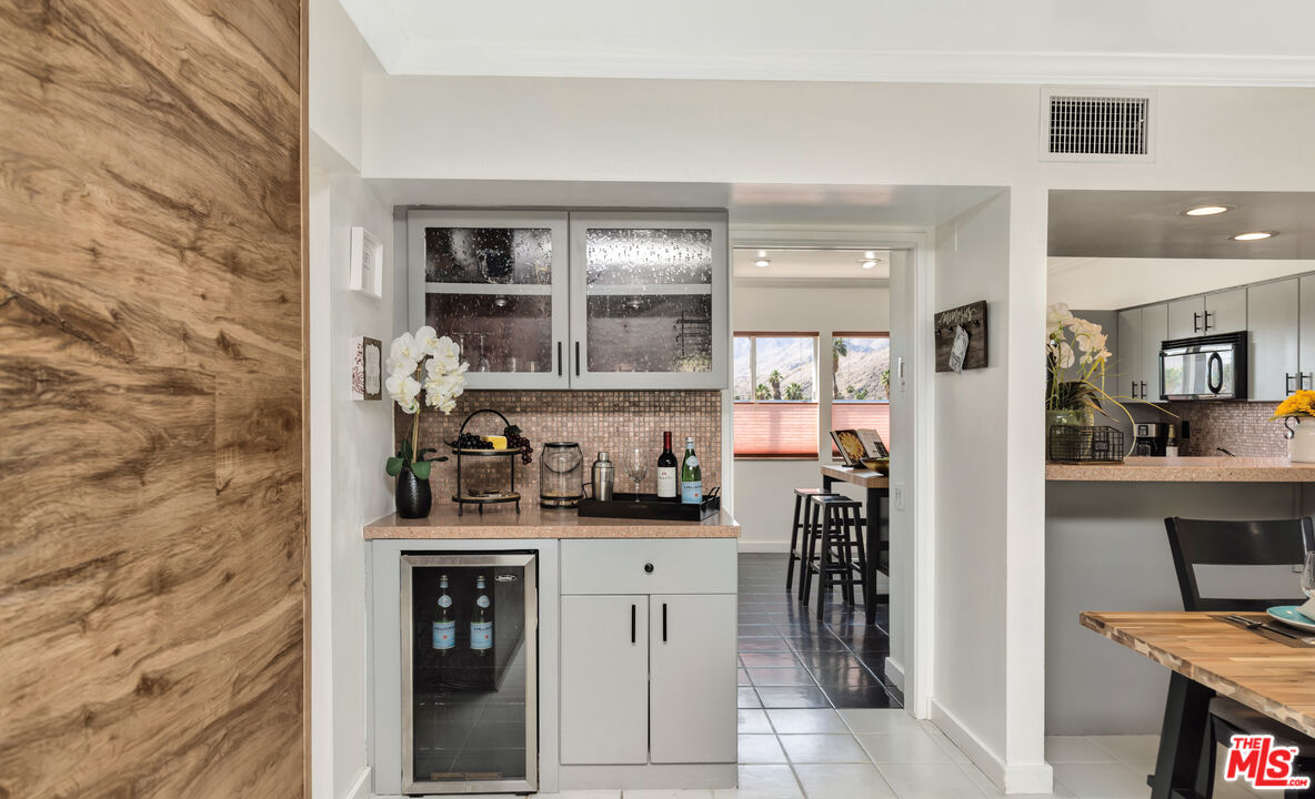 277 East Alejo Road, Unit 119 Palm Springs, CA 92262 - Photo 13 of 46 a kitchen with a sink and cabinets