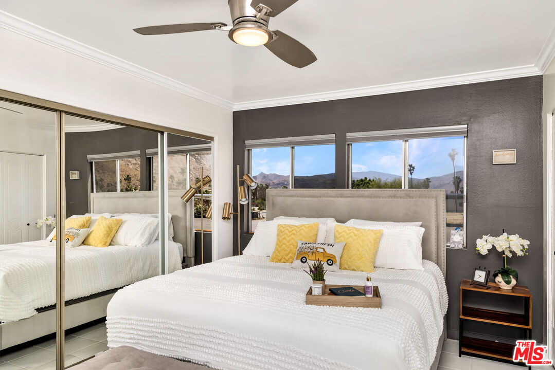 277 East Alejo Road, Unit 119 Palm Springs, CA 92262 - Photo 19 of 46 a bedroom with a bed and window