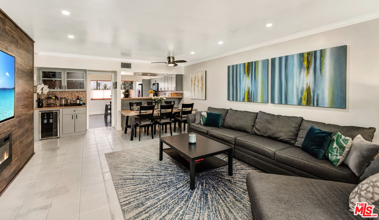 277 East Alejo Road, Unit 119 Palm Springs, CA 92262 - Photo 2 of 46 a living room with stainless steel appliances kitchen island granite countertop furniture and a kitchen view
