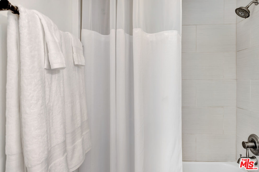 277 East Alejo Road, Unit 119 Palm Springs, CA 92262 - Photo 28 of 46 a close up view of a shower curtain