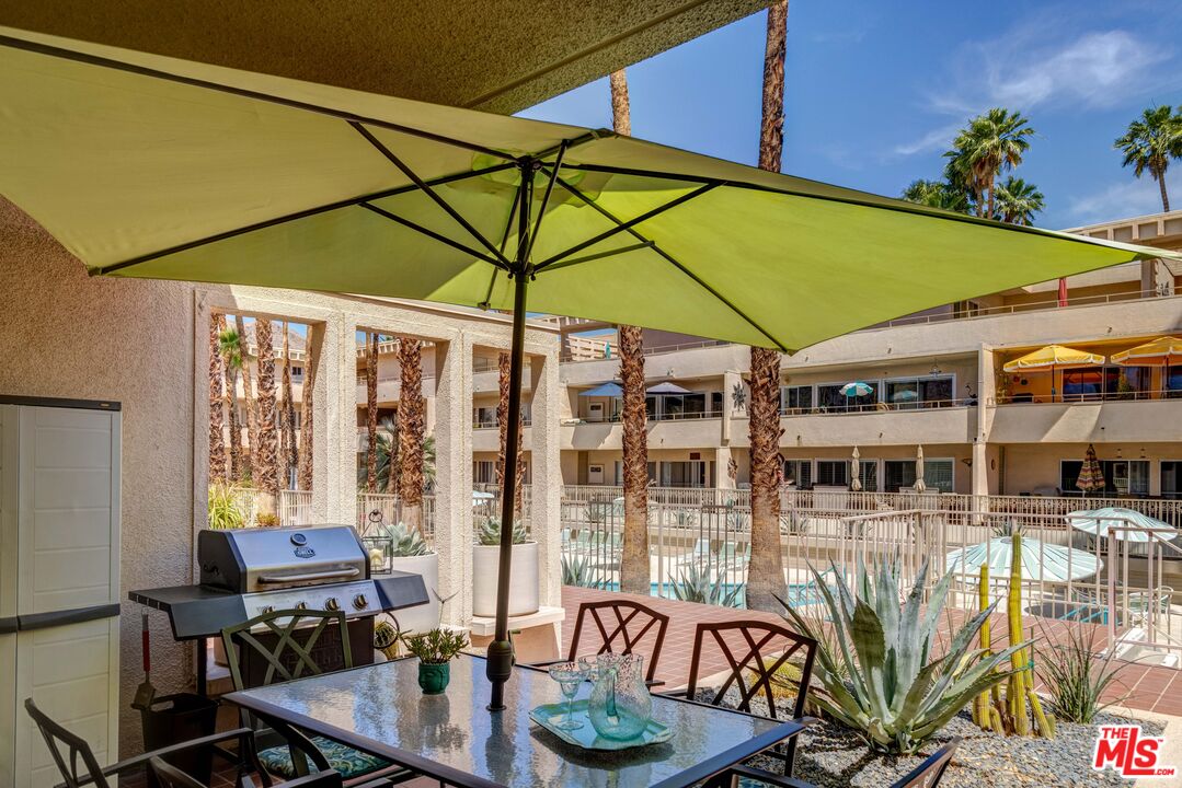 277 East Alejo Road, Unit 119 Palm Springs, CA 92262 - Photo 41 of 46 a table and chairs in the patio