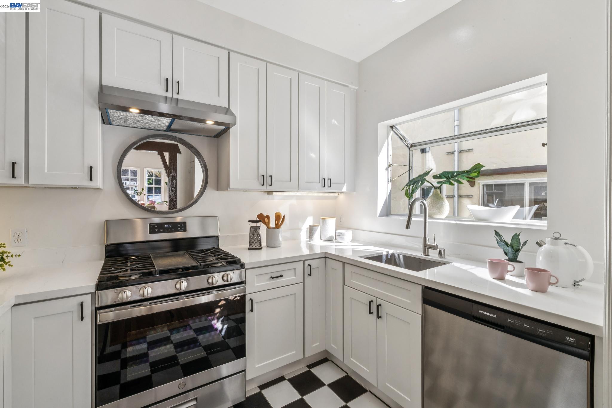 2365 Virginia Street, Unit 2 Berkeley, CA 94709 - Photo 12 of 19 a kitchen with stainless steel appliances a sink stove and cabinets