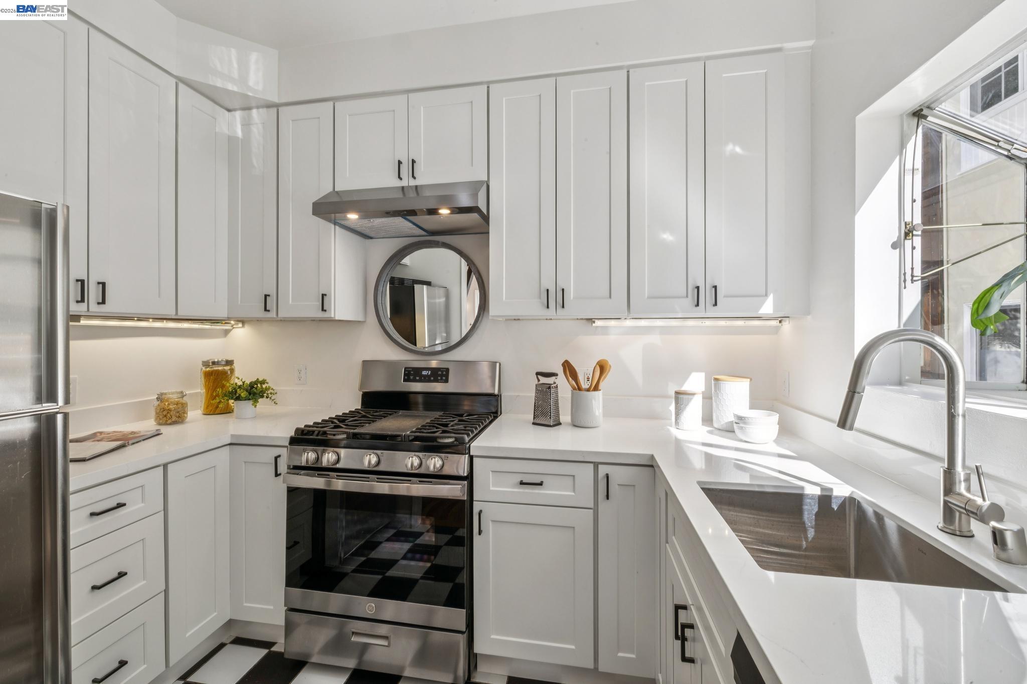 2365 Virginia Street, Unit 2 Berkeley, CA 94709 - Photo 13 of 19 a kitchen with cabinets a stove and a sink