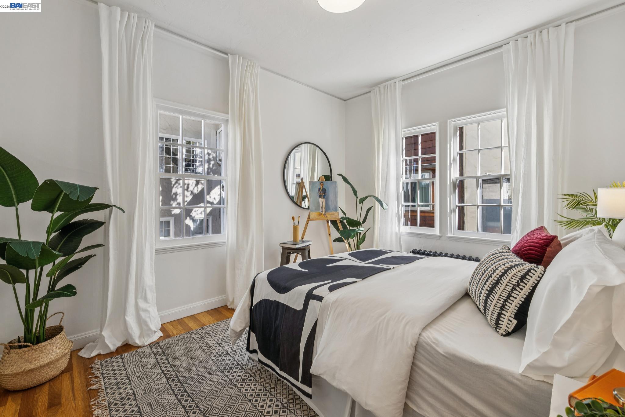 2365 Virginia Street, Unit 2 Berkeley, CA 94709 - Photo 15 of 19 a bedroom with a bed and a potted plant