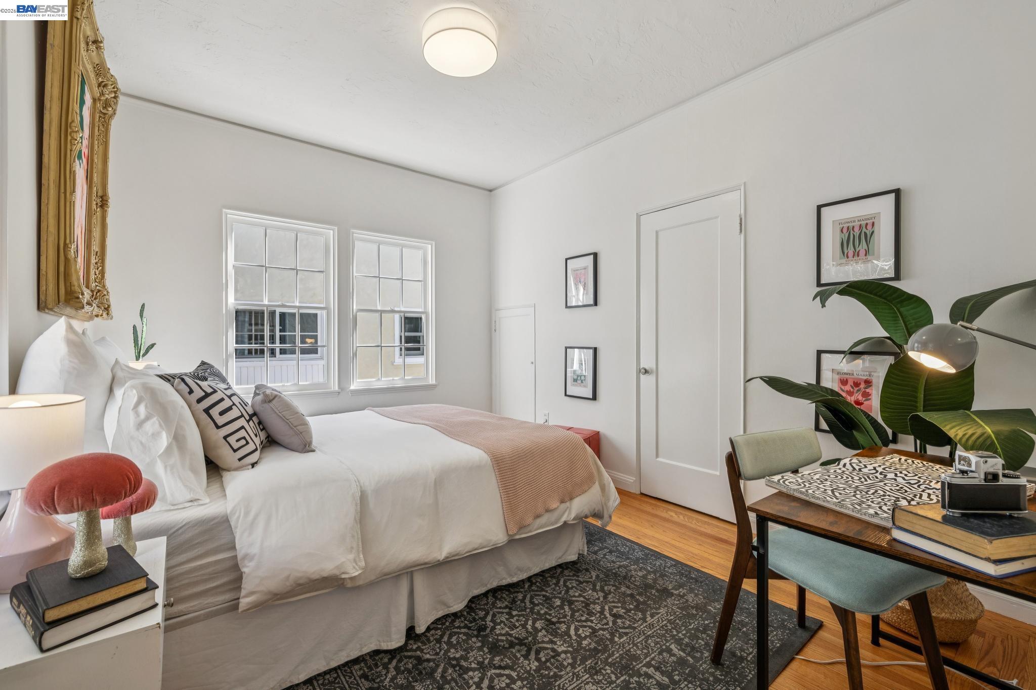 2365 Virginia Street, Unit 2 Berkeley, CA 94709 - Photo 17 of 19 a bedroom with a bed and wooden floor
