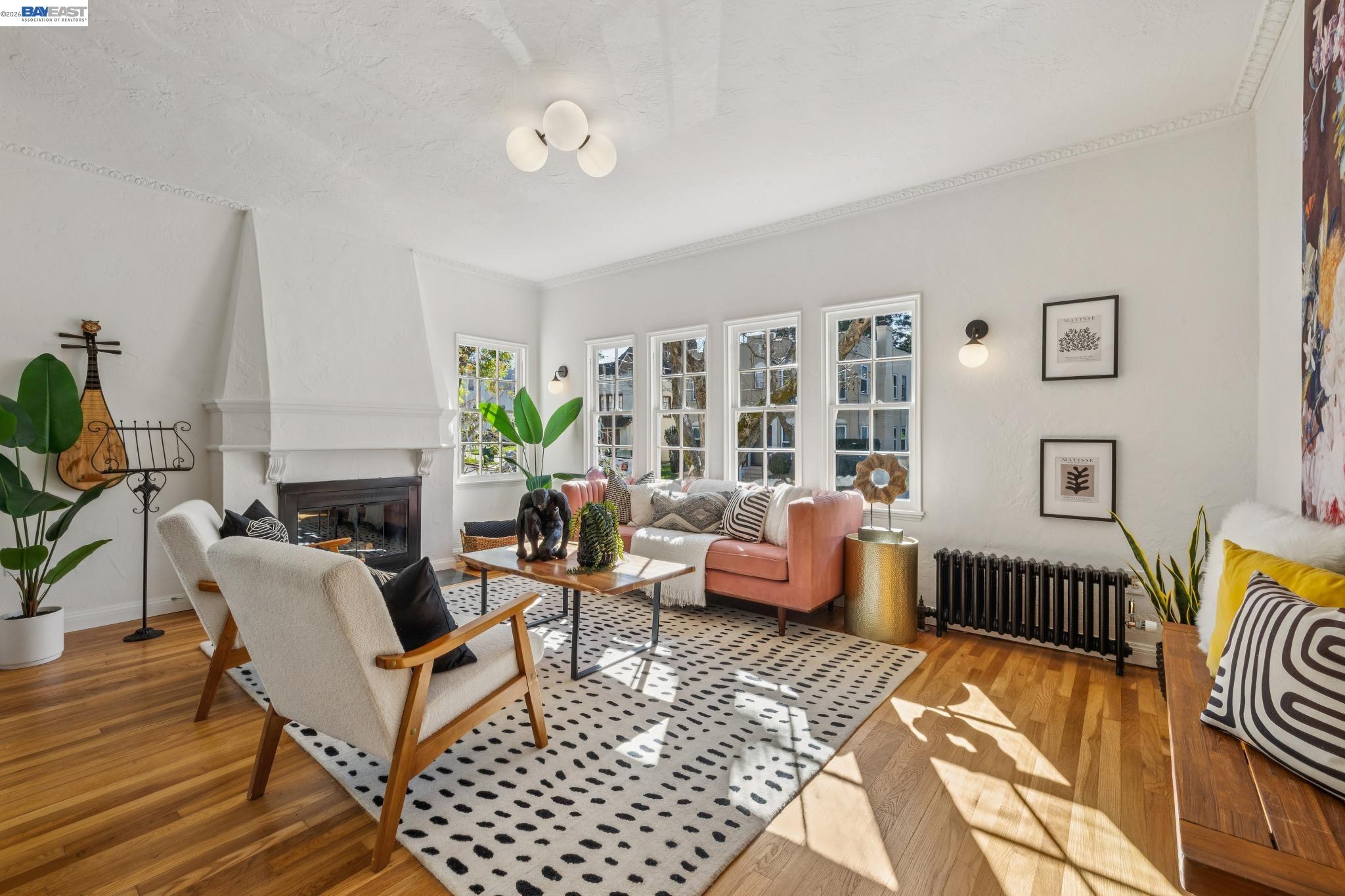 2365 Virginia Street, Unit 2 Berkeley, CA 94709 - Photo 6 of 19 a living room with furniture a fireplace and a table