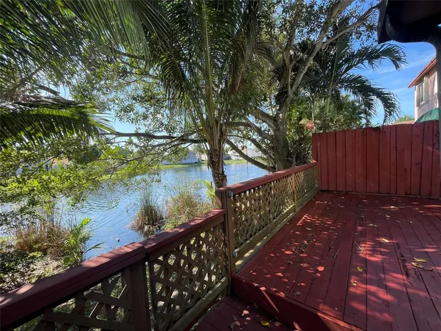 a view of a pathway with a bench in a yard