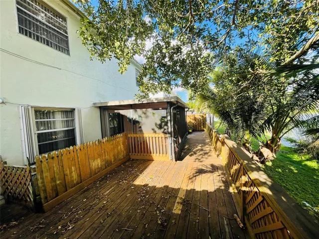a view of a house with a tree in the background