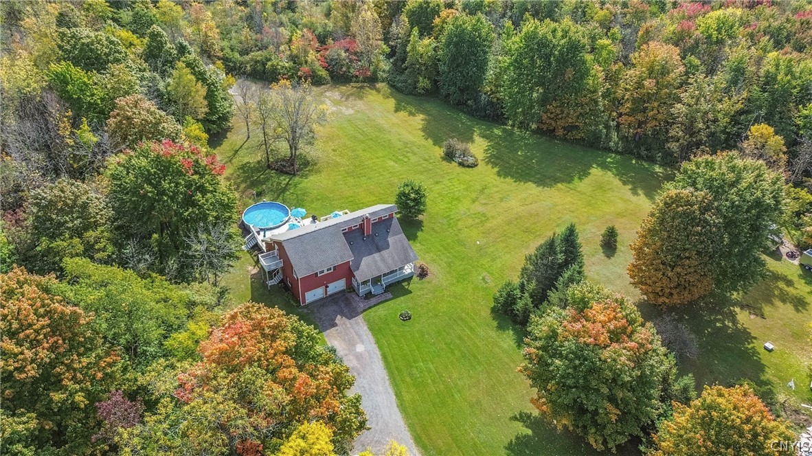 15384 Fuller Road Adams, NY 13606 - Photo 16 of 50 Mature trees frame a sprawling green lawn surrounding this private country home.