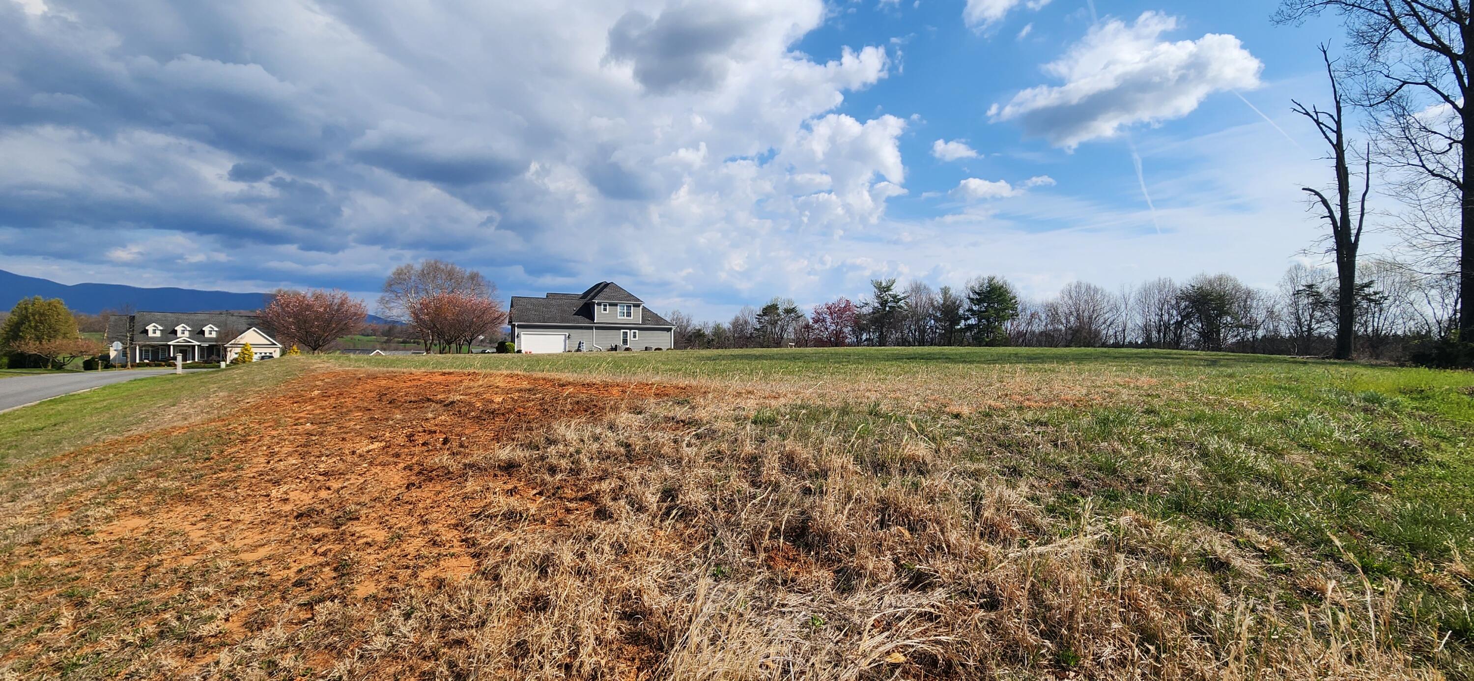Lot 3 Callaway Road Rocky Mount, VA 24151 - Photo 3 of 4 a view of a lake with houses in the background