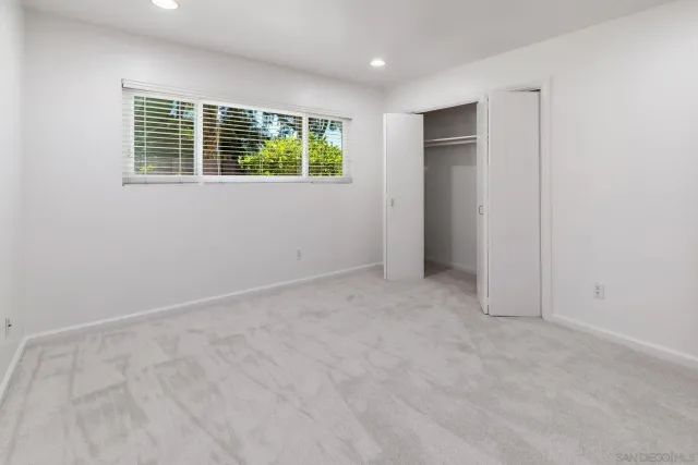 a bathroom with a granite countertop sink and a granite counter top