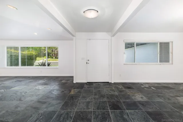 en empty room with windows