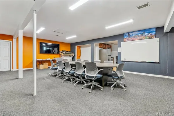 a view of a big room with chairs chandeliers and wooden floor