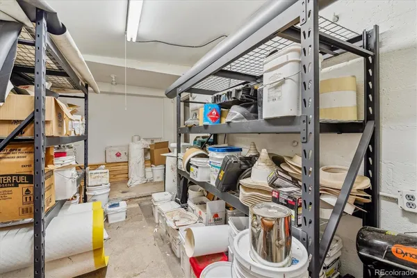 a utility room with dryer washer and a wooden floor