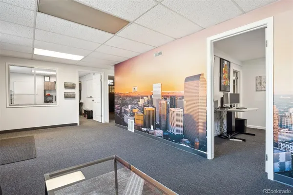 a view of a livingroom with furniture and a window