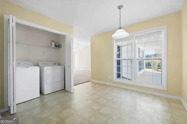 a view of a room with dryer and washer