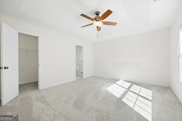 a view of room with ceiling fan