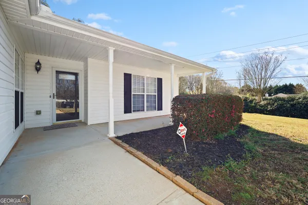 a front view of a house with garden