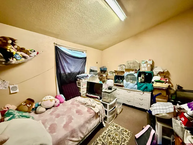 a living room with furniture and next to a window