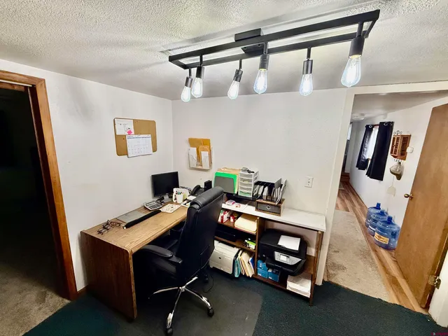 a view of living room with furniture and a flat screen tv