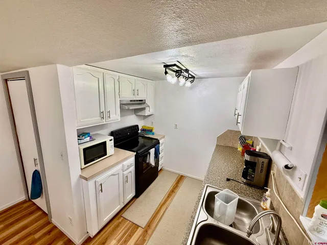 a view of a hallway with washer and dryer