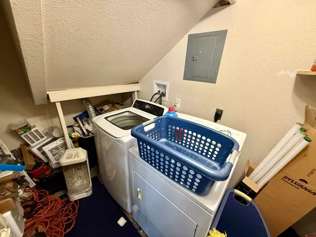 a bedroom with a bed and cupboard