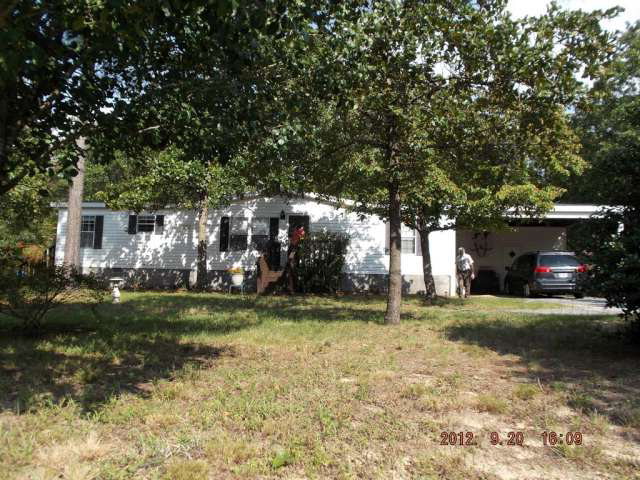 537 Wildwood Road Fort Valley, GA 31030 - Photo 1 of 1 a view of a park that has large trees with wooden fence