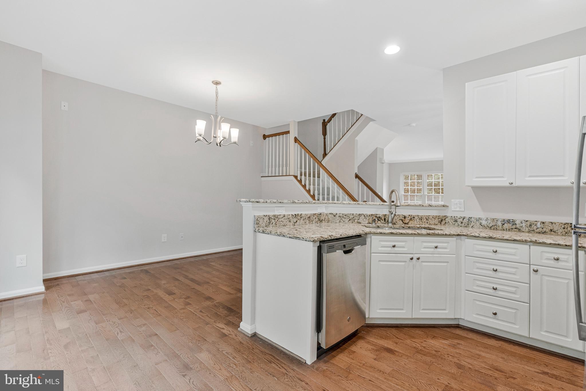 12033 Edgemere Circle Reston, VA 20190 - Photo 16 of 53 a kitchen with granite countertop a stove and a sink