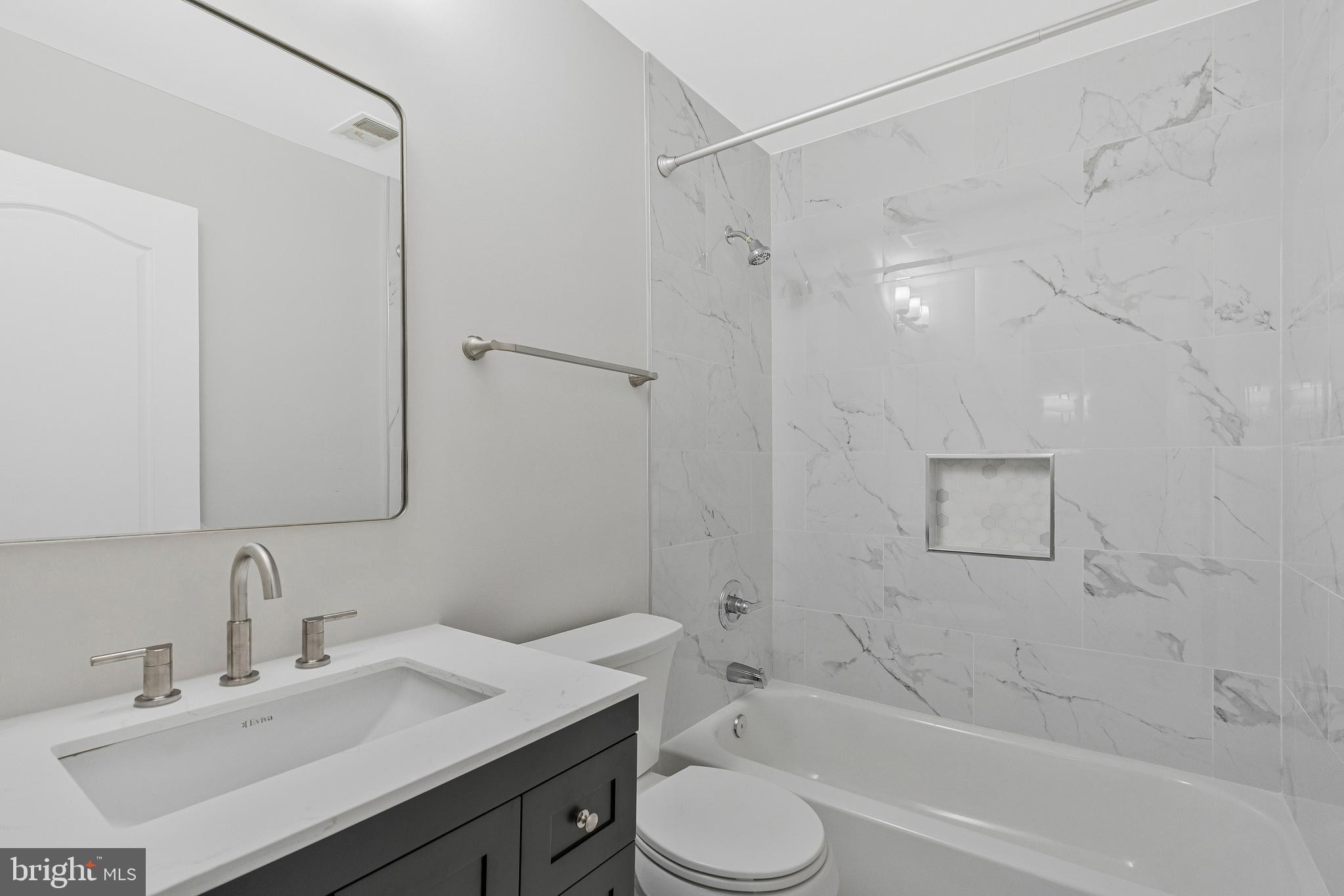 12033 Edgemere Circle Reston, VA 20190 - Photo 33 of 53 a bathroom with a sink toilet vanity and shower