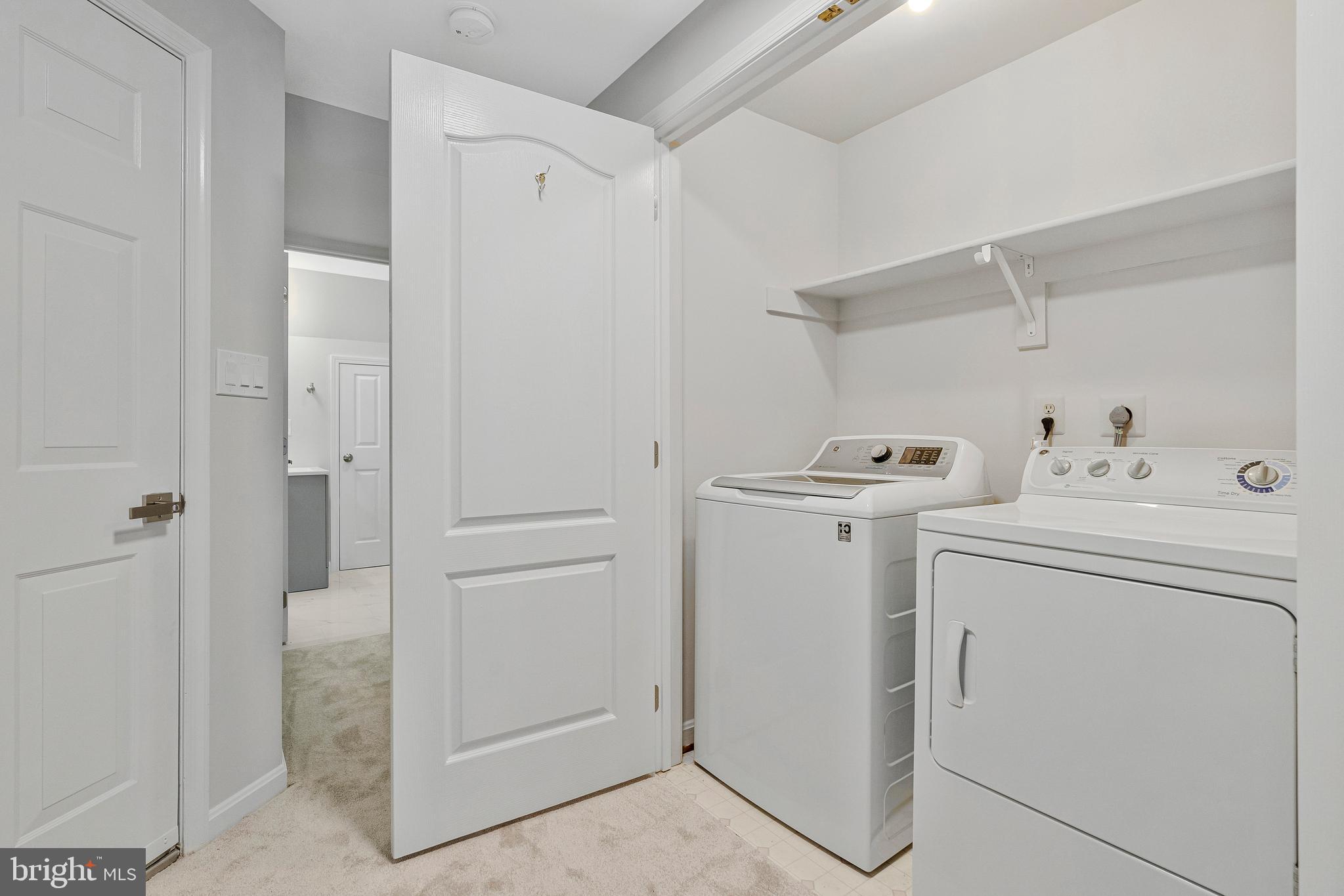 12033 Edgemere Circle Reston, VA 20190 - Photo 34 of 53 a view of storage and utility room with washer and dryer