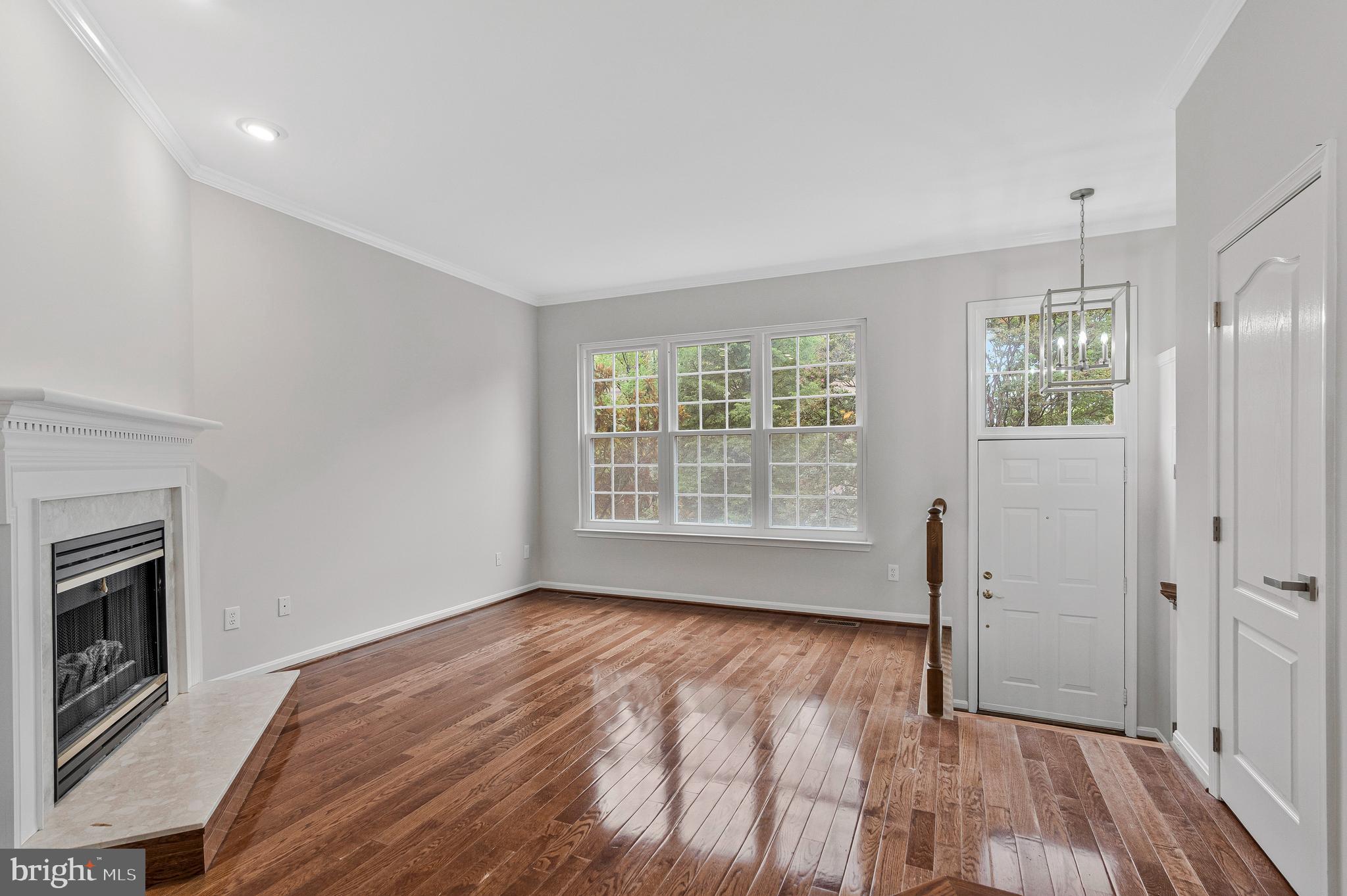 12033 Edgemere Circle Reston, VA 20190 - Photo 7 of 53 a view of an empty room with a window and wooden floor