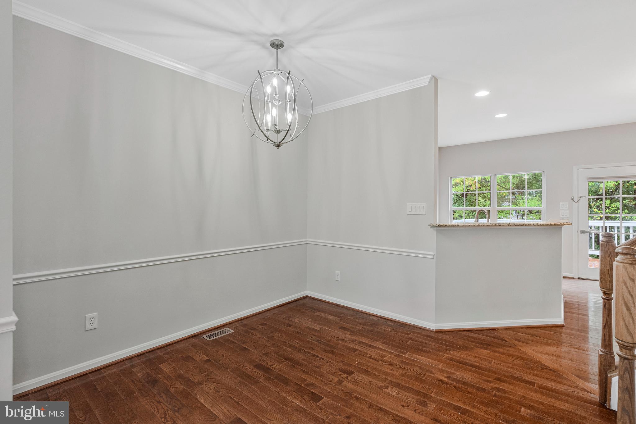 12033 Edgemere Circle Reston, VA 20190 - Photo 10 of 53 an empty room with wooden floor and window