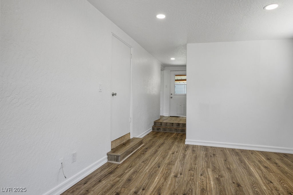 633 5th Street Boulder City, NV 89005 - Photo 18 of 29 Unfurnished room featuring dark wood-type flooring, recessed lighting, and a textured ceiling