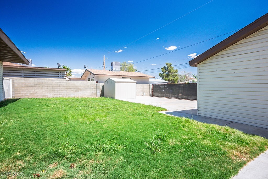 633 5th Street Boulder City, NV 89005 - Photo 9 of 29 Fenced backyard featuring an outbuilding