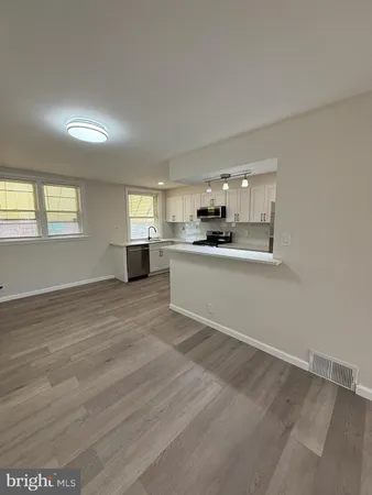 a view of a kitchen with a sink cabinets and a window