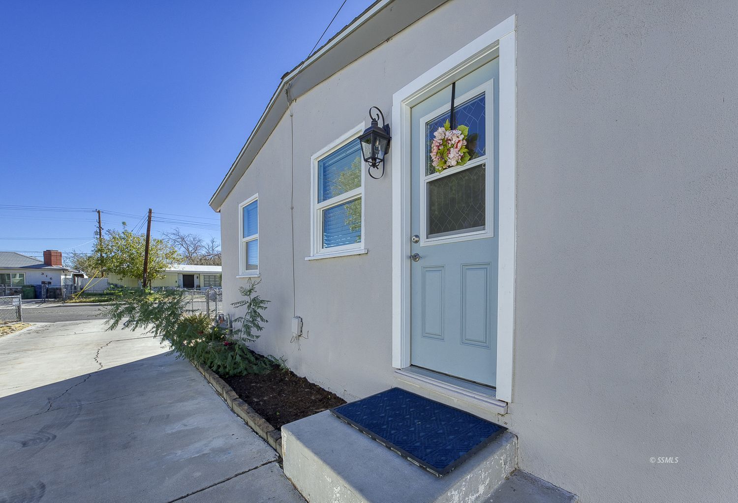 305 North Warner Street Ridgecrest, CA 93555 - Photo 29 of 30 a view of front door and potted plants