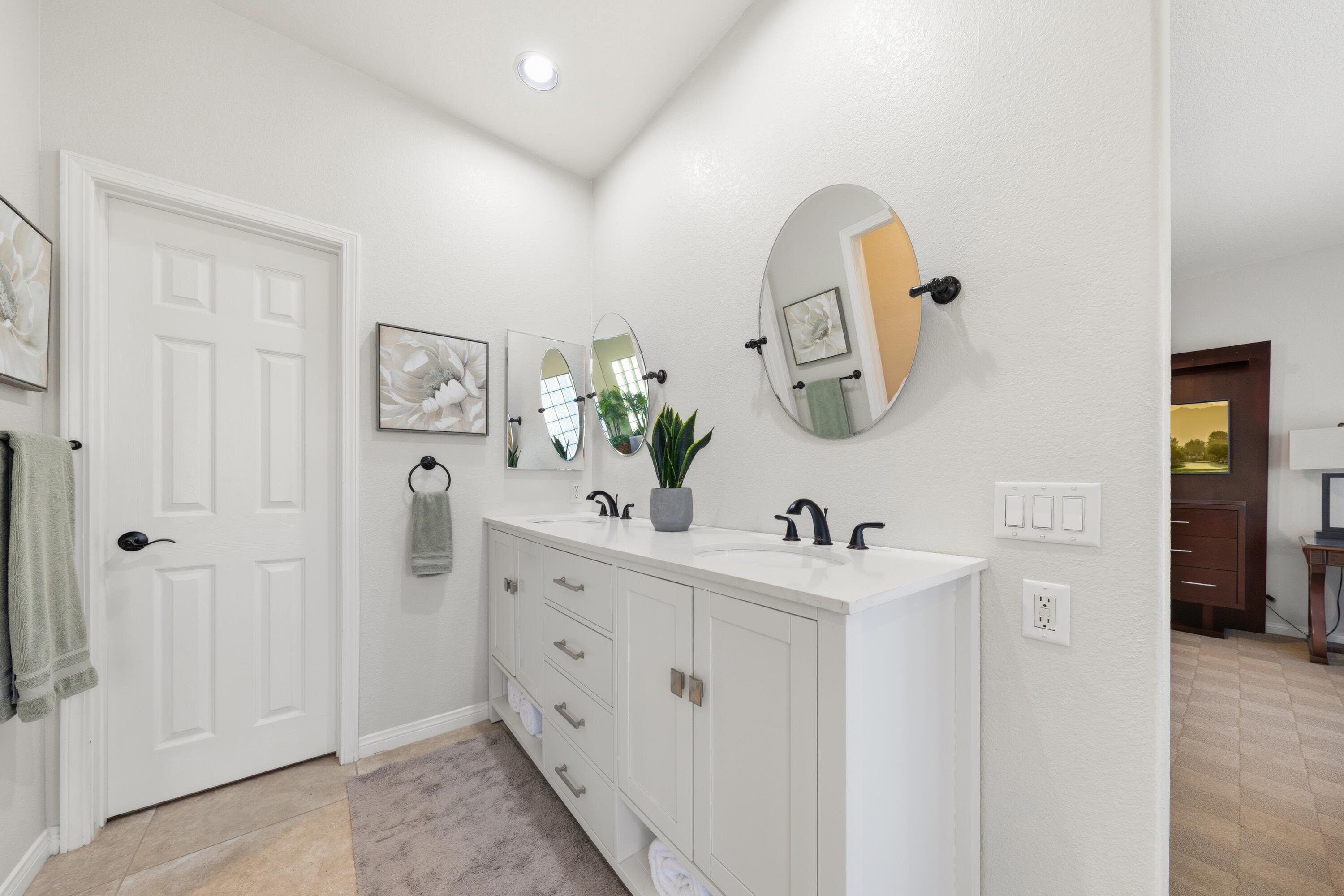 39 Augusta Drive Rancho Mirage, CA 92270 - Photo 30 of 53 a bathroom with a sink and mirror