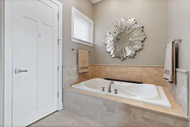 a bathroom with a tub and a shower