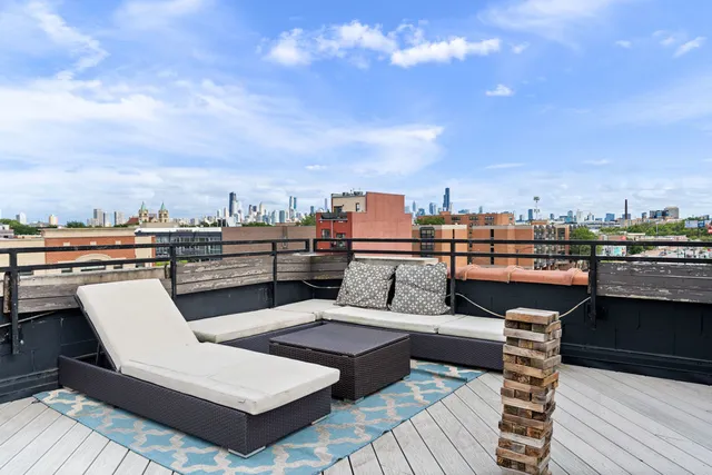 a view of a terrace with outdoor seating