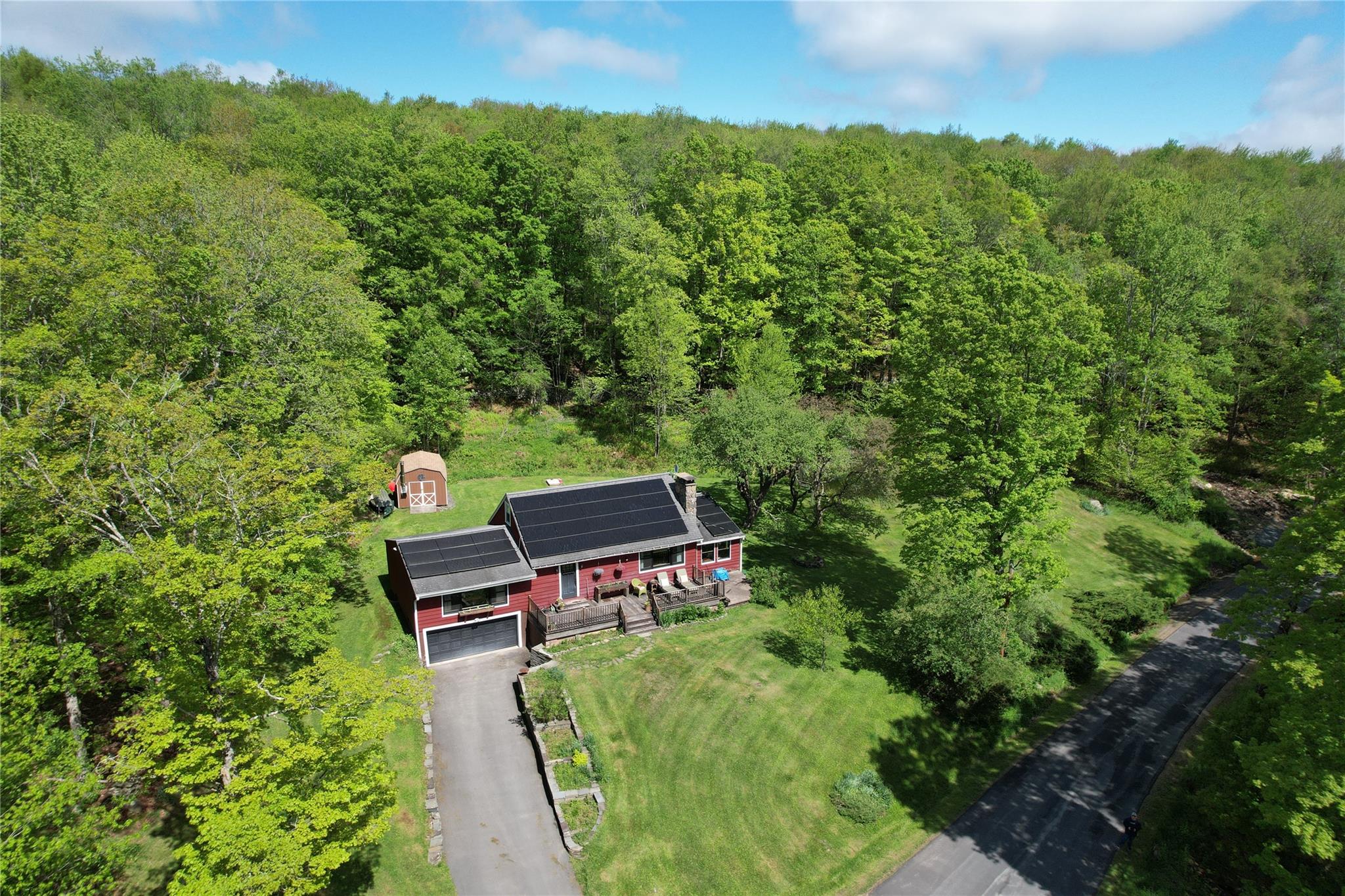 223 Church Road Livingston Manor, NY 12758 - Photo 1 of 1 Aerial view of property and surrounding area with a forest