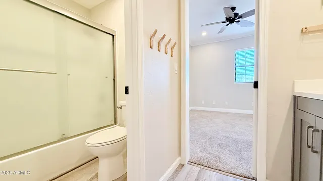 a view of a big house with a big yard and large trees