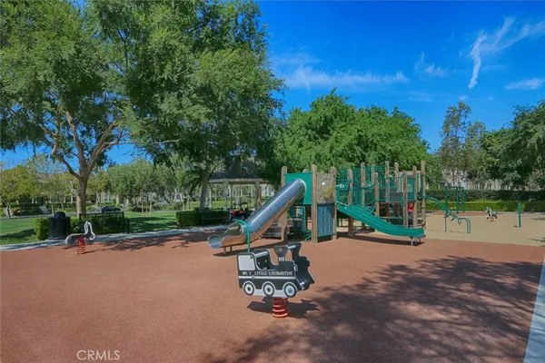 a view of a park with swings and slides