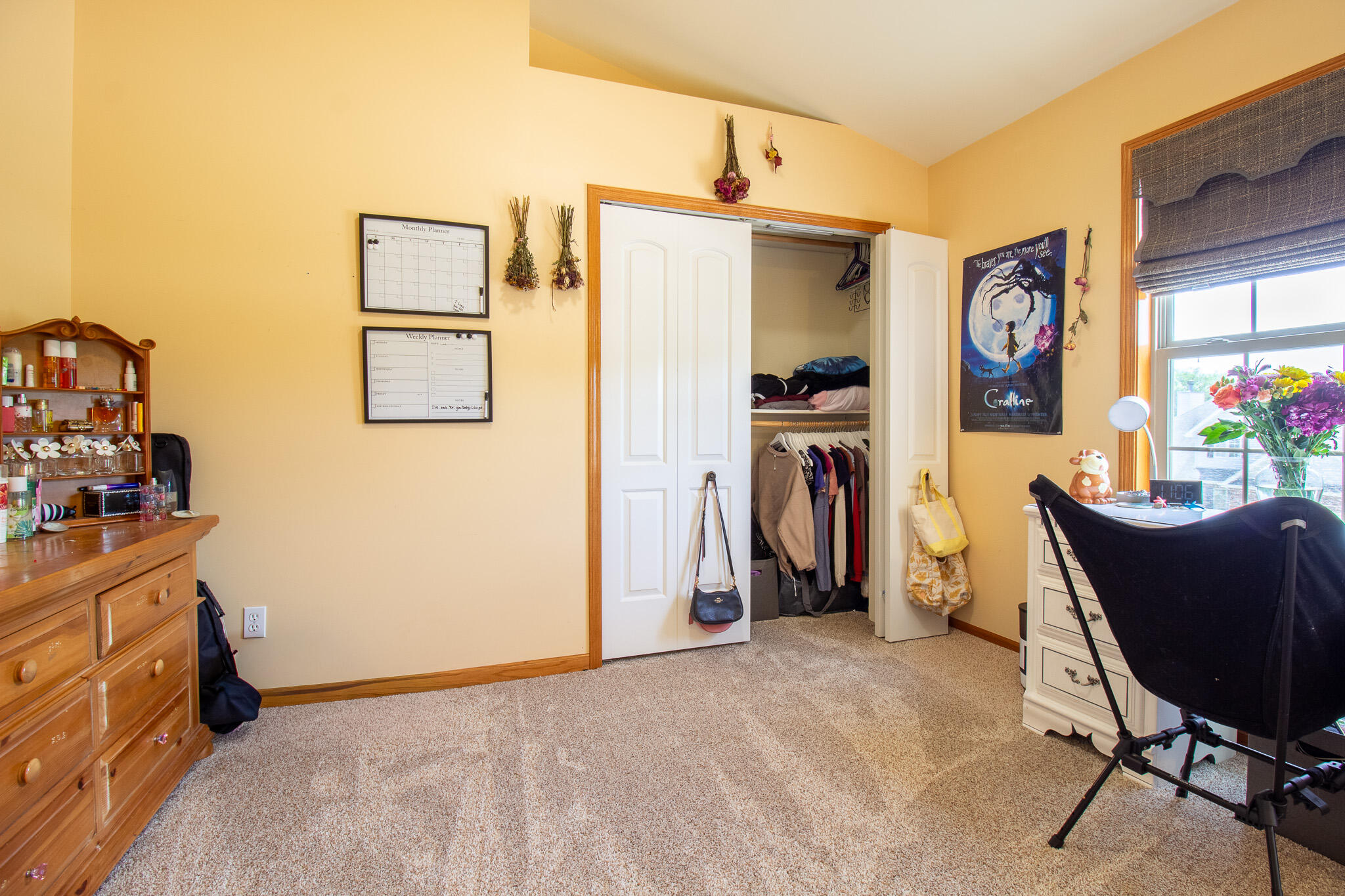 2550 Honelee Court Valparaiso, IN 46385 - Photo 25 of 37 a living room with furniture a flat screen tv and a refrigerator