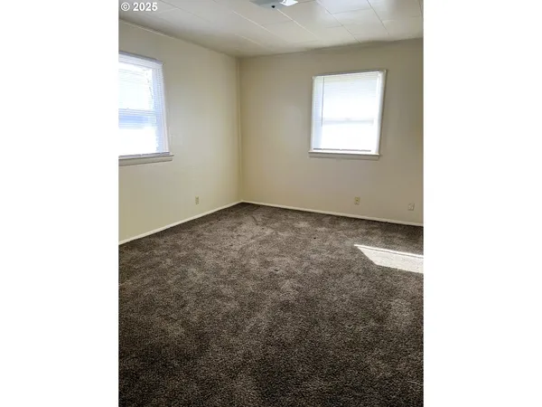 a view of a room that has a window in it