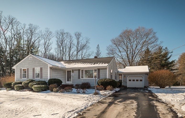 29 Old Ferry Road Haverhill, MA 01830 - Photo 1 of 42 a front view of a house with a yard covered with snow in the background