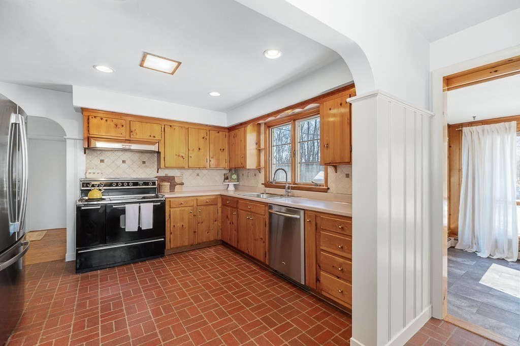 29 Old Ferry Road Haverhill, MA 01830 - Photo 11 of 42 a kitchen with granite countertop stainless steel appliances and window